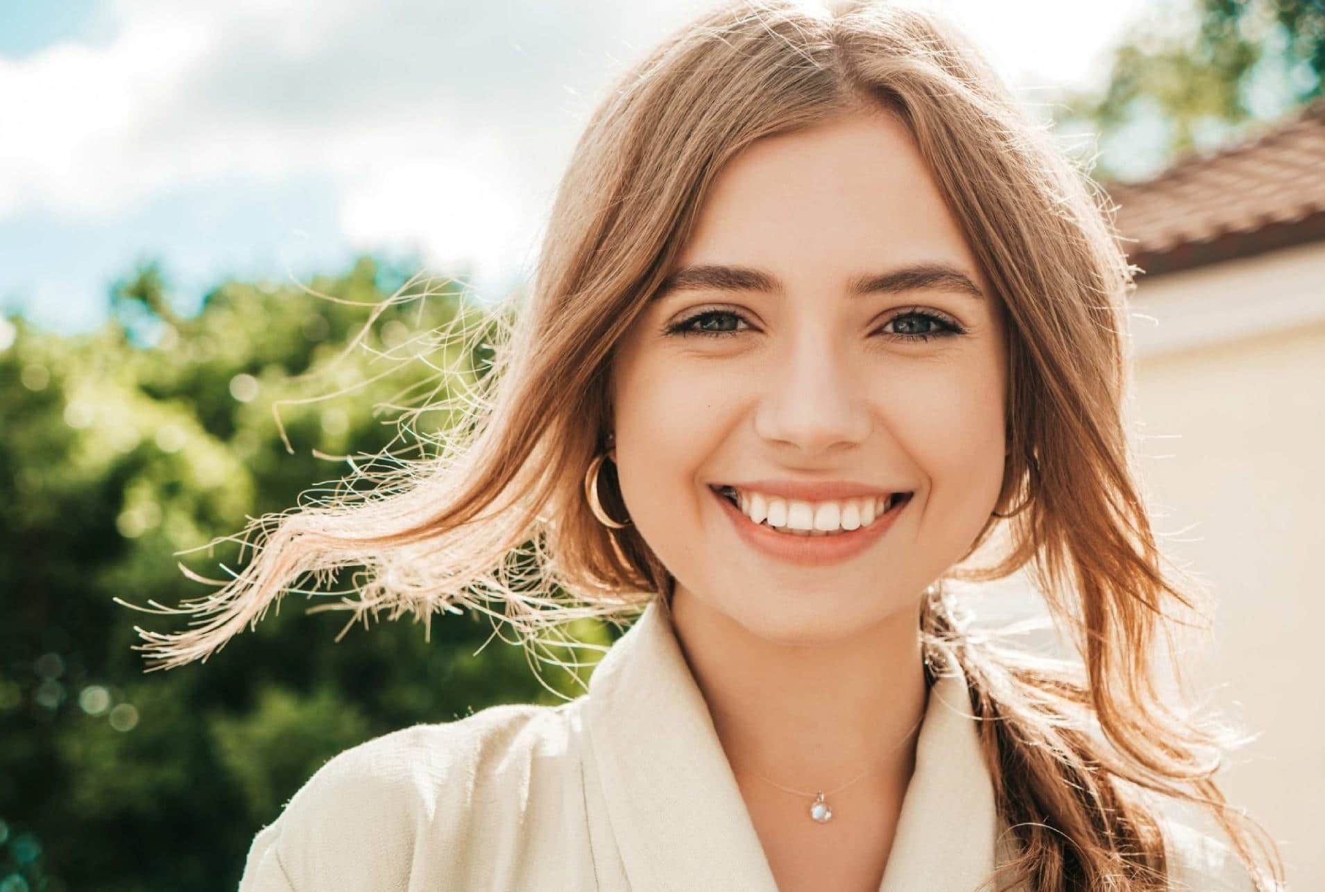 Young woman smiling showing beautiful teeth