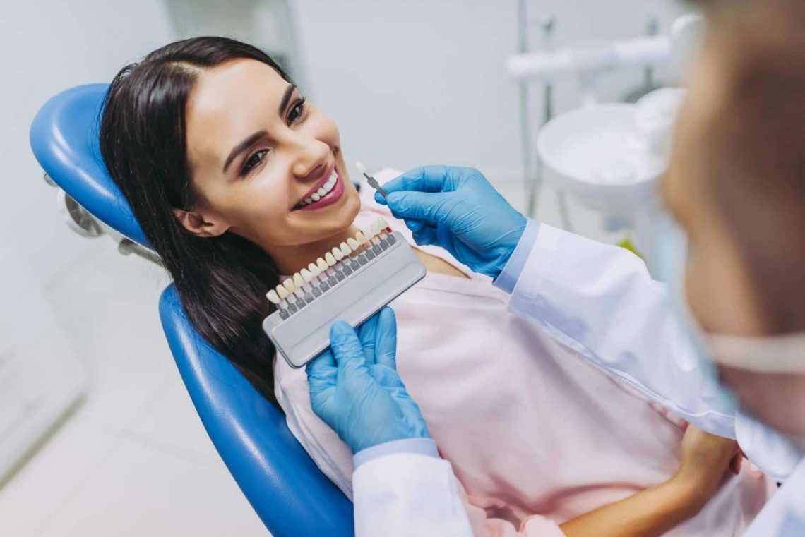 lady at the dentist choosing tooth implant