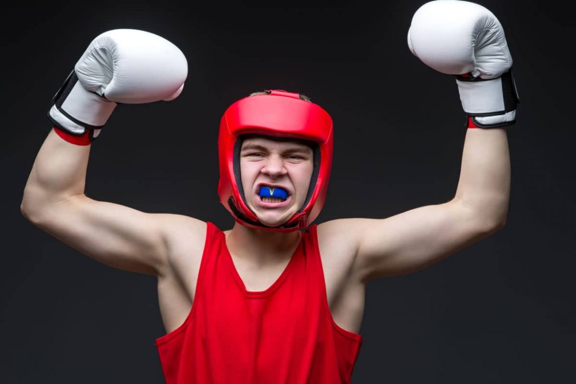 Young boxer with mouthguard